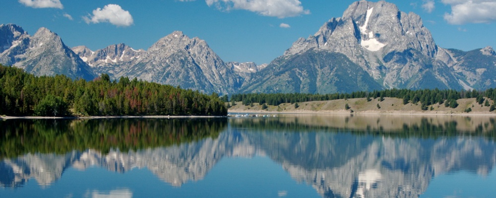 Grand Teton across Jackson Lake with Puffy Clouds